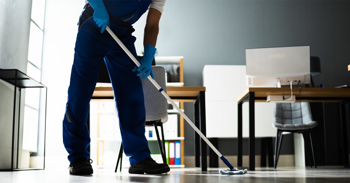 A local cleaning pro at work, wiping down an office floor area