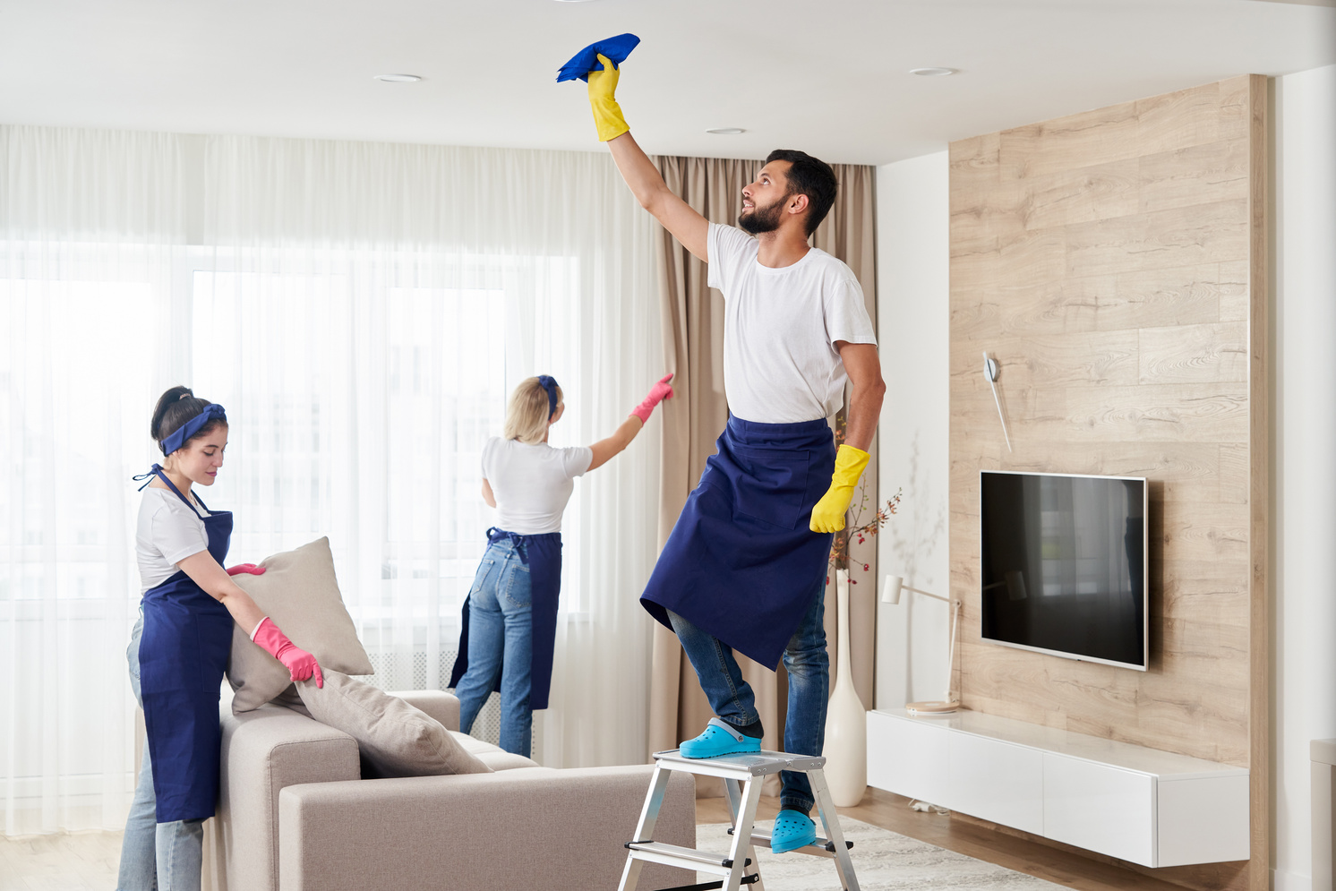 A cleaning team resetting a bright apartment, ready for the next tenant